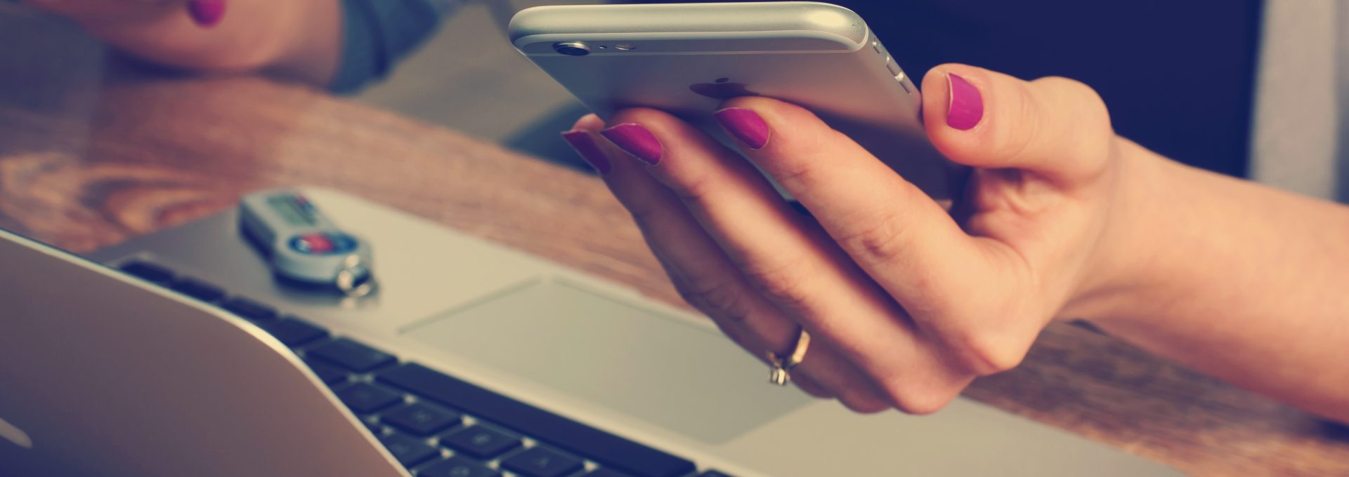 woman holding silver iPhone 6