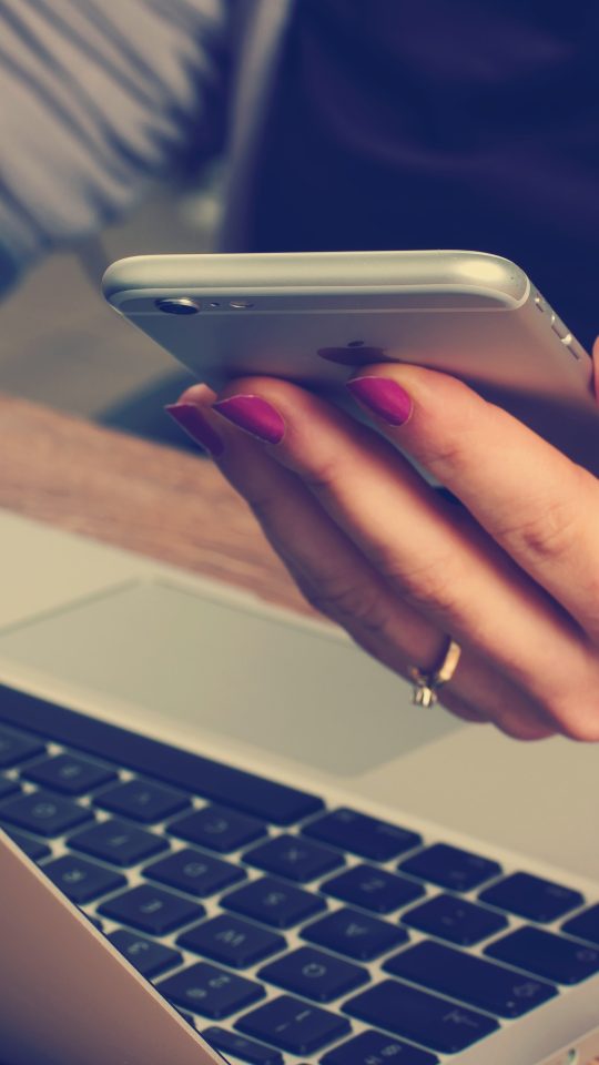 woman holding silver iPhone 6